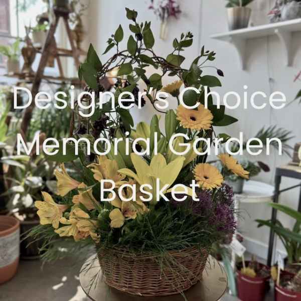 Basket arrangement with yellow flowers and greenery