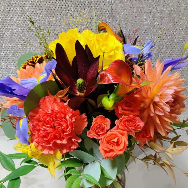 Colorful bouquet of mixed flowers in a glass vase