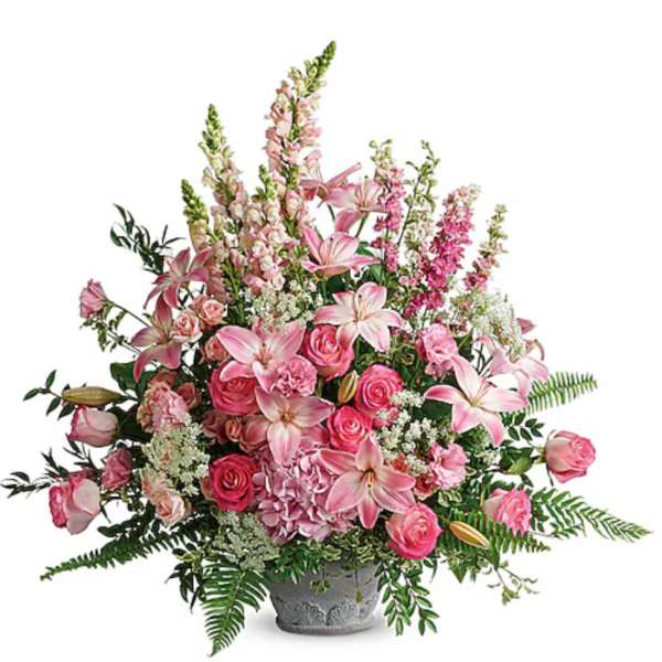 Pink lilies and roses in a gray vase