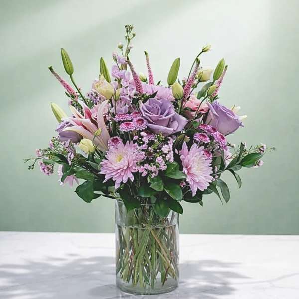 Lavender and pink bouquet in a clear glass vase