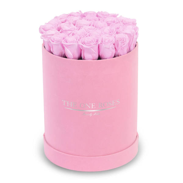 Pink roses arranged in a round pink box