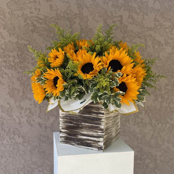 Sunflower arrangement in a square wooden box with white ribbon