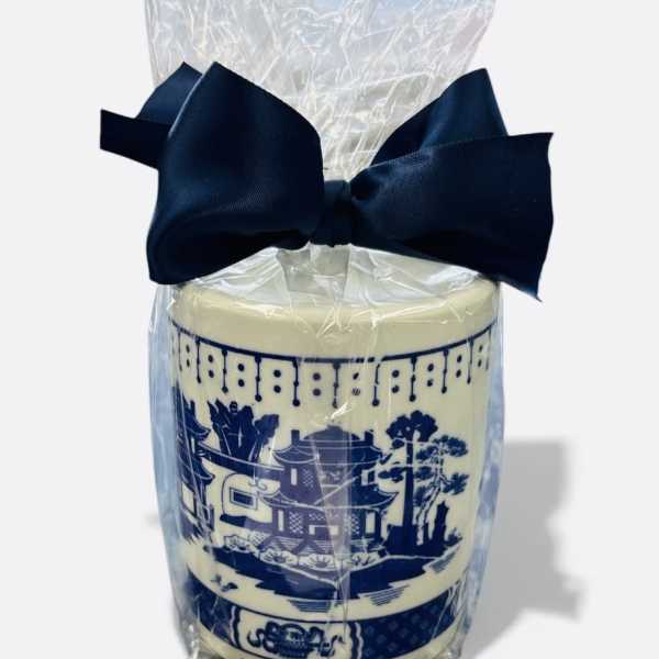 Wrapped decorative candle with a navy bow
