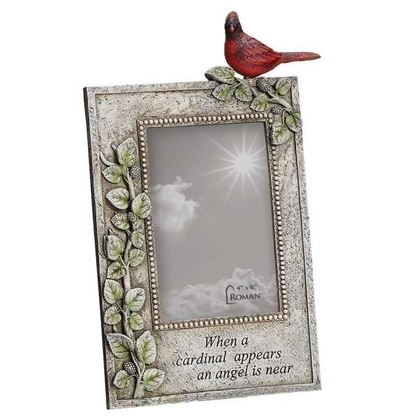 Decorative photo frame with a red cardinal on top and leaf accents