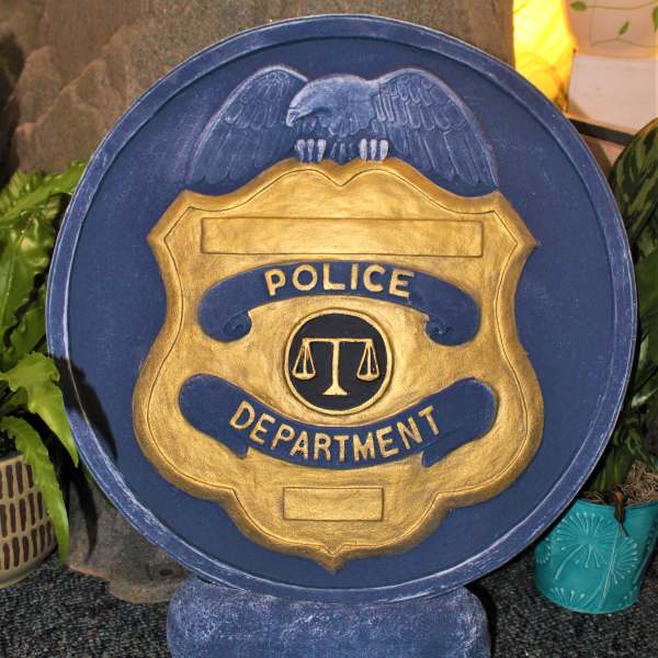 Blue and gold police department plaque with an eagle emblem