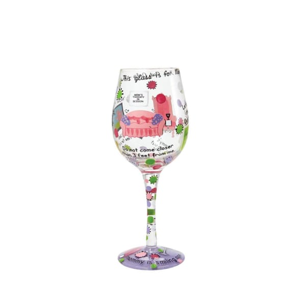 Decorated wine glass with colorful text and cartoon graphics