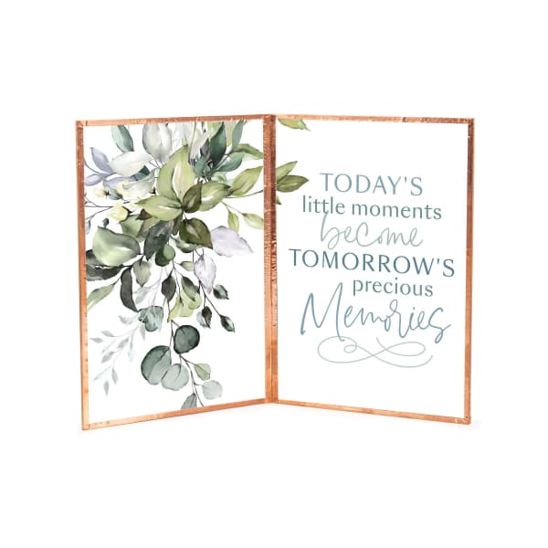 Folded framed sign with watercolor leaves and a quote about memories