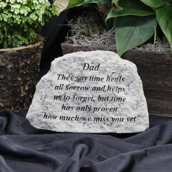 Engraved memorial stone with a message for Dad