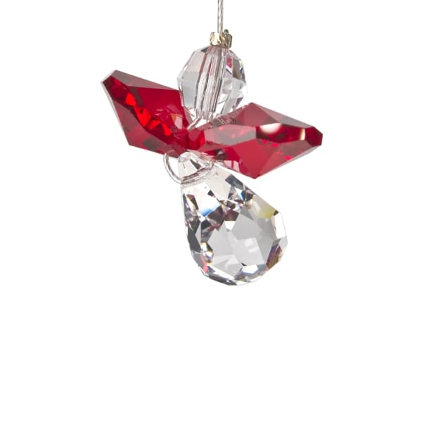 Red and clear crystal angel ornament hanging on a white background