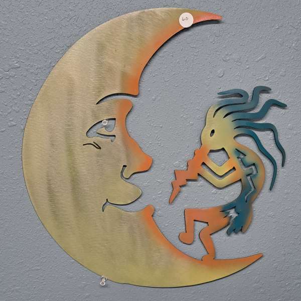 Metal wall art of a crescent moon facing a figure playing a flute