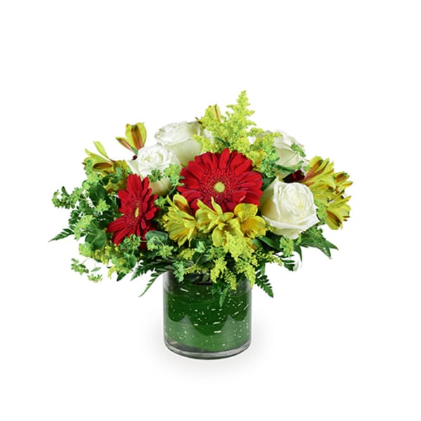 Red gerberas and white roses in a glass vase