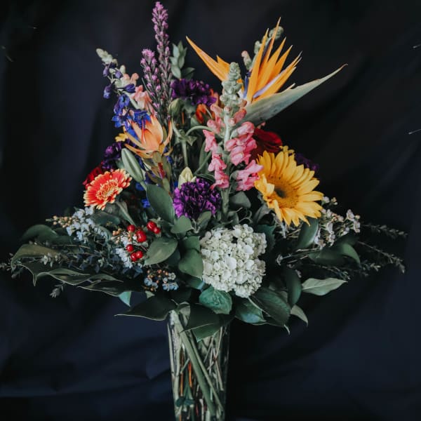 Colorful mixed bouquet in a clear glass vase