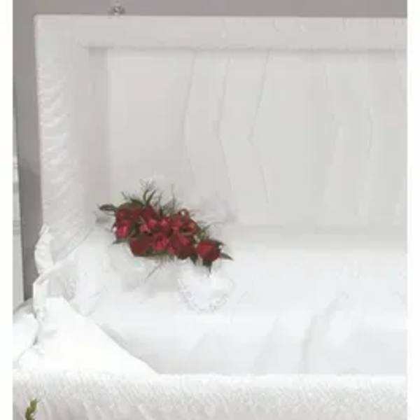 Small bouquet of red flowers in a white gift box