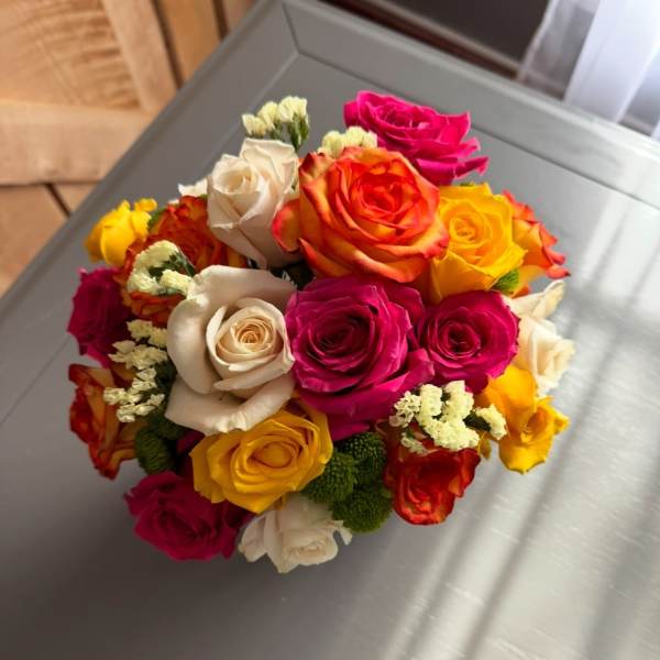 Bouquet of multicolored roses with small filler flowers