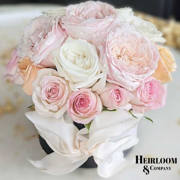 Blush and white rose bouquet with a satin ribbon wrap