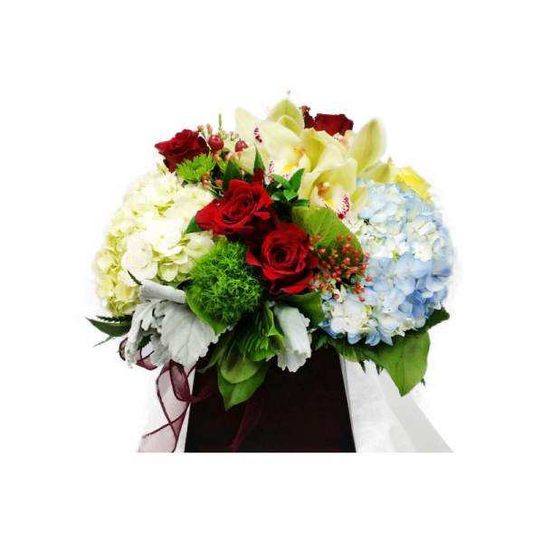 Bouquet of red roses, pale hydrangeas, and yellow orchids