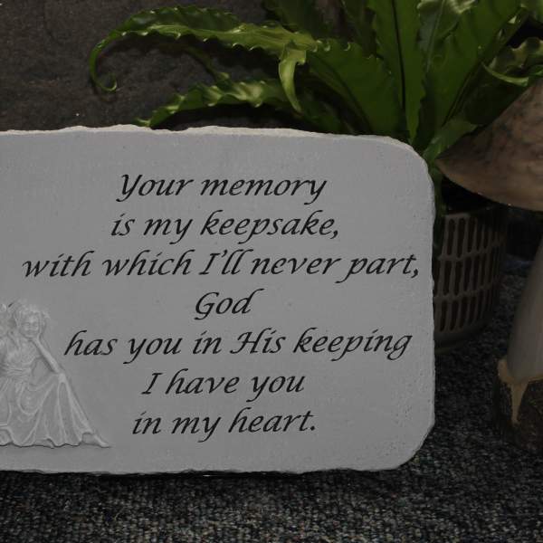 Memorial plaque with an angel and a sympathy verse
