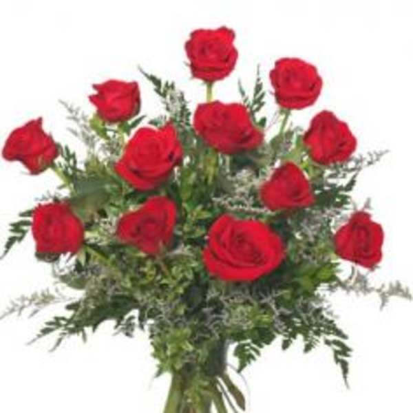 Bouquet of red roses in a clear glass vase