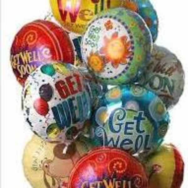 Cluster of colorful printed balloons with birthday messages
