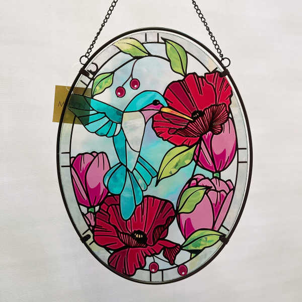 Oval stained-glass hummingbird and flowers hanging by a chain