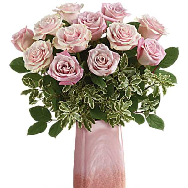 Pink roses arranged in a tall pink vase