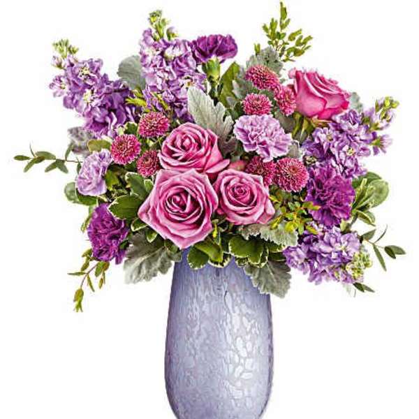 Pink and purple bouquet in a lavender vase