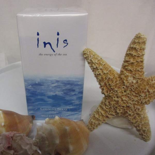 Cologne spray box with seashells and a starfish on a tray