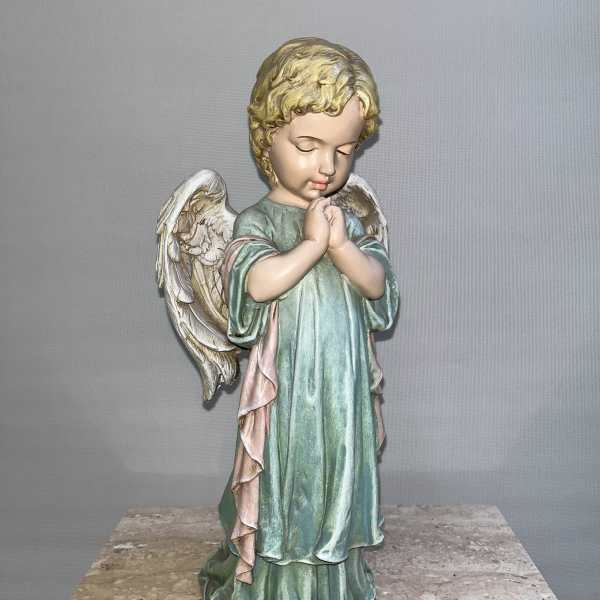 Praying angel figurine with pastel robe and white wings
