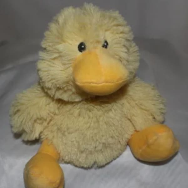 Plush yellow duck toy with orange beak and feet