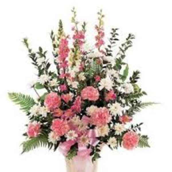 Pink and white floral arrangement in a vase