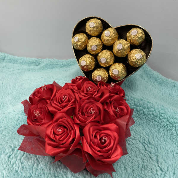 Red rose bouquet with a heart-shaped box of gold-wrapped chocolates