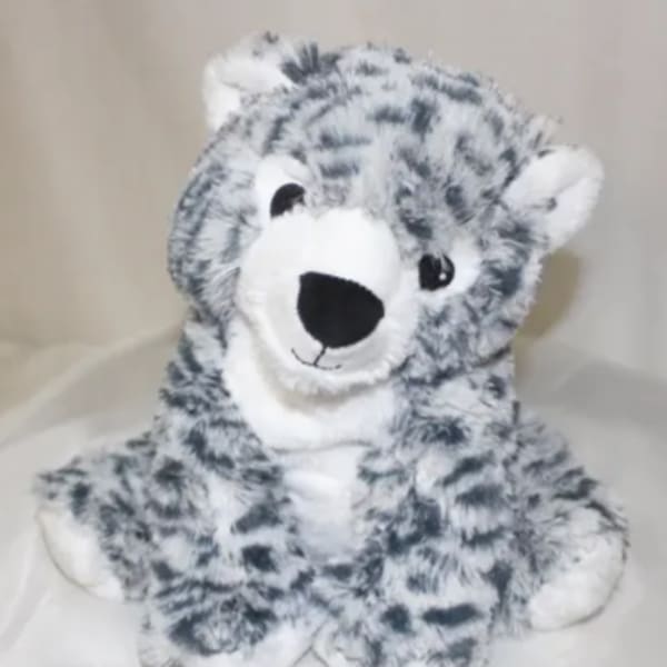 Plush gray-and-white stuffed tiger sitting upright