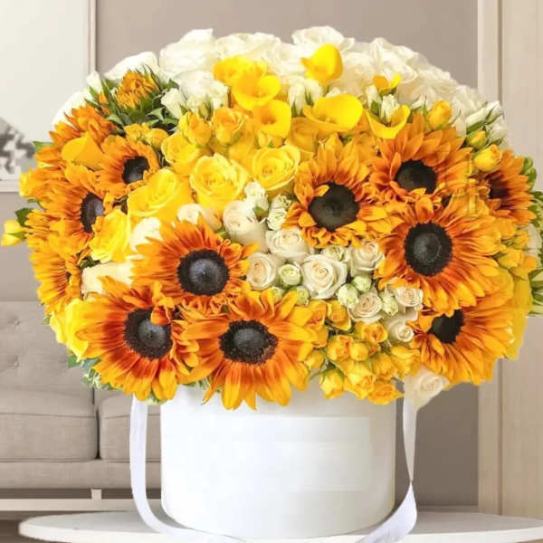 Large bouquet of yellow and orange sunflowers with white roses in a white box