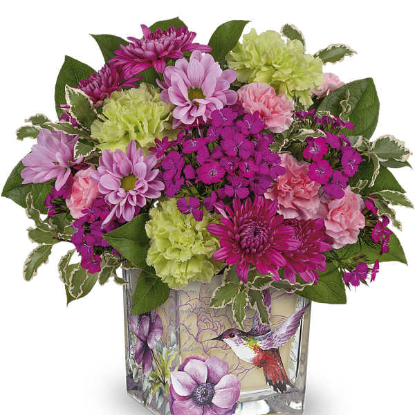 Pink and green mixed flower arrangement in a decorated glass vase
