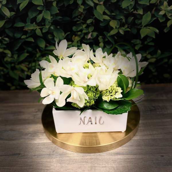 Classy Orchids in White on a Soft Bed of Hydrangeas