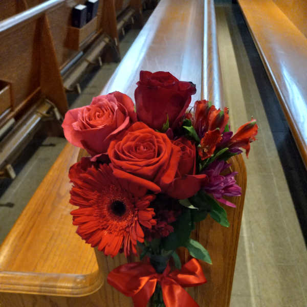 Red rose bouquet with a gerbera daisy and ribbon