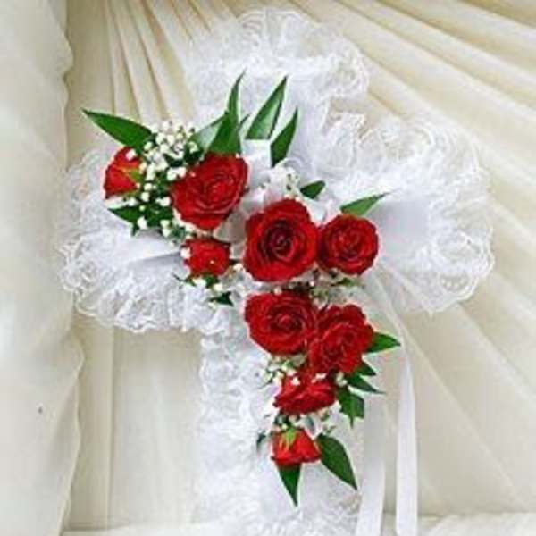 White lace bridal bouquet with red roses and ribbon