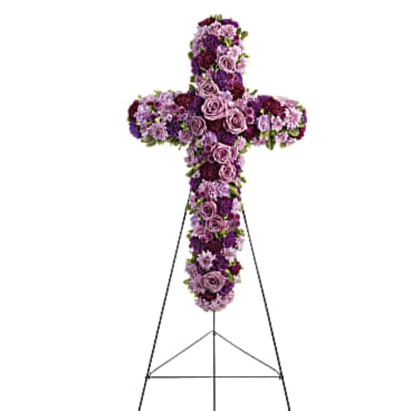 Purple floral cross on a metal stand
