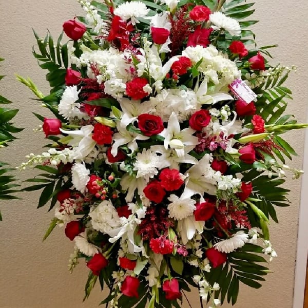 Large standing floral spray with red and white flowers