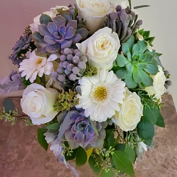 Bouquet of white roses, white daisies, and purple succulents