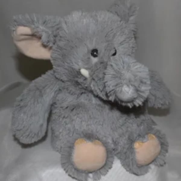 Gray plush elephant toy with pink inner ears and feet