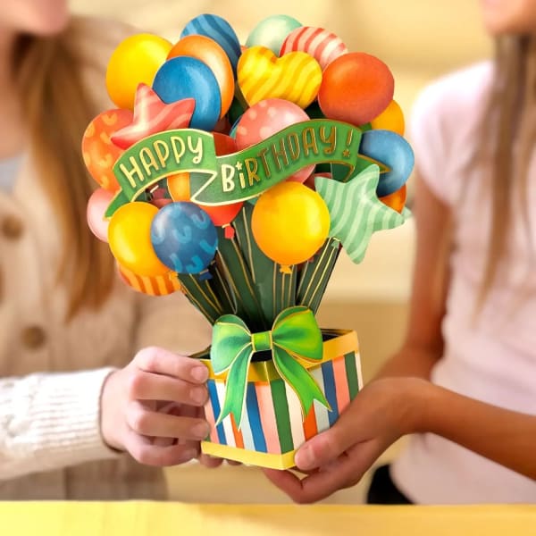 Birthday balloon bouquet in a striped gift box