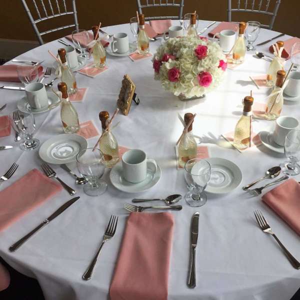 Centerpieces done with a highgingers and roses from Roma Florist