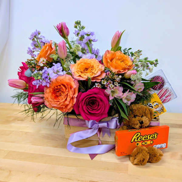 Mixed bouquet in a wooden box with a teddy bear and candy box