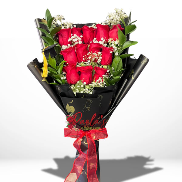 Bouquet of red roses with white baby's breath in black wrap and red ribbon