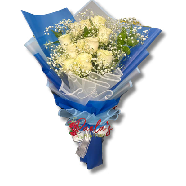 Bouquet of pale yellow roses wrapped in blue paper