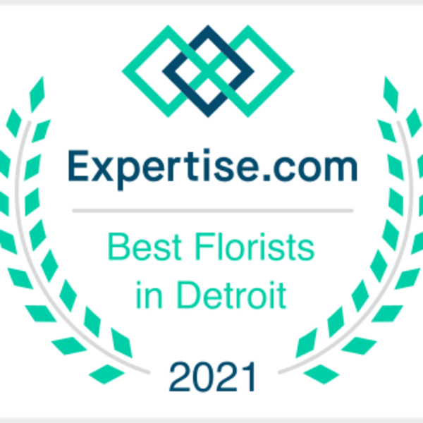 Expertise.com award badge with laurel wreath and text