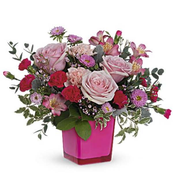 Pink and red mixed bouquet in a magenta vase