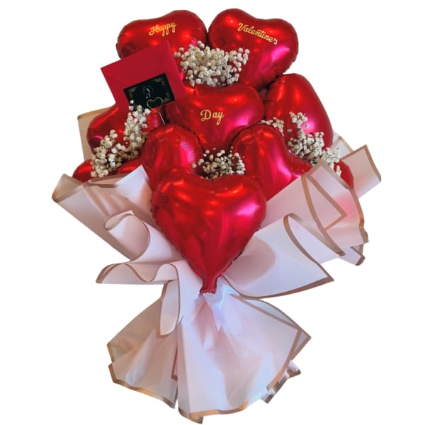 Bouquet of red heart balloons with baby's breath and pink wrapping