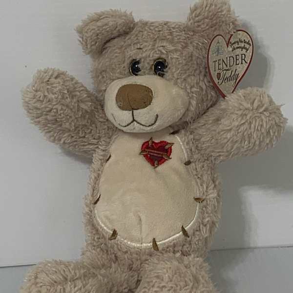 Plush teddy bear with a heart tag